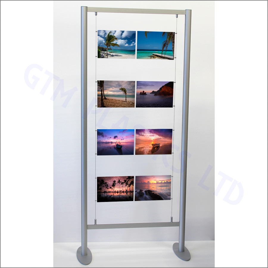 A freestanding 2-metre high anodised aluminium frame, supporting A4 and A3 poster holders suspended between cables that are attached to its crossbars.