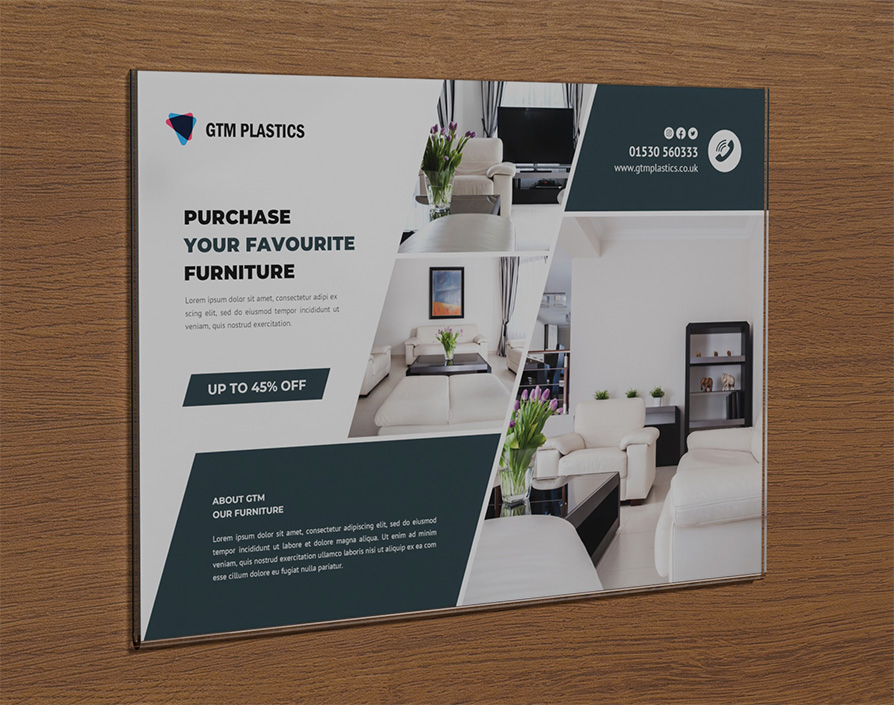 An acrylic wall mounted poster holder attached to the wall with double-sided sticky pads. The poster is advertising furniture for sale.